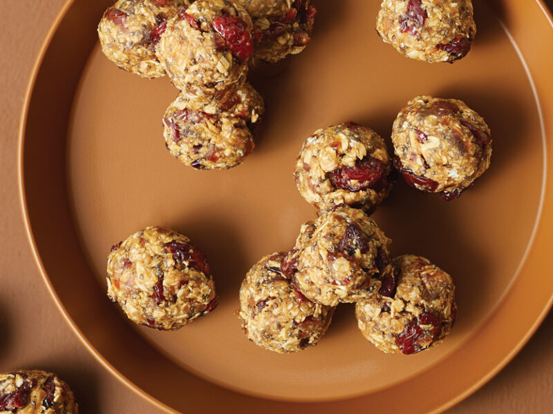Cherry Oat Snack Balls on an orange plate