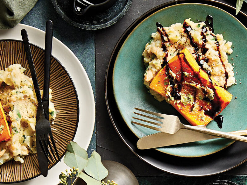 Garlic Squash Steaks with Herbed Pear-Potato Mash on turquoise plates with metal cutlery