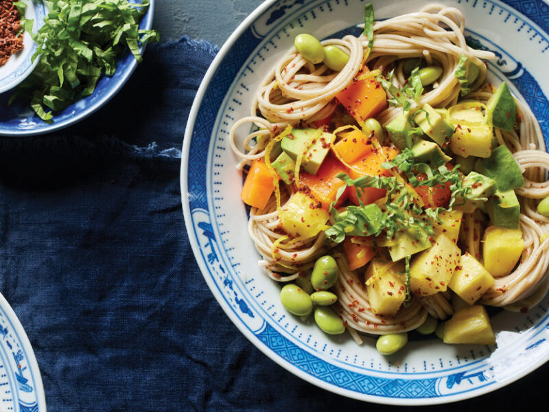 Tropical Soba Noodle Bowls in white and blue china bowls with chopsticks on a blue tablecloth