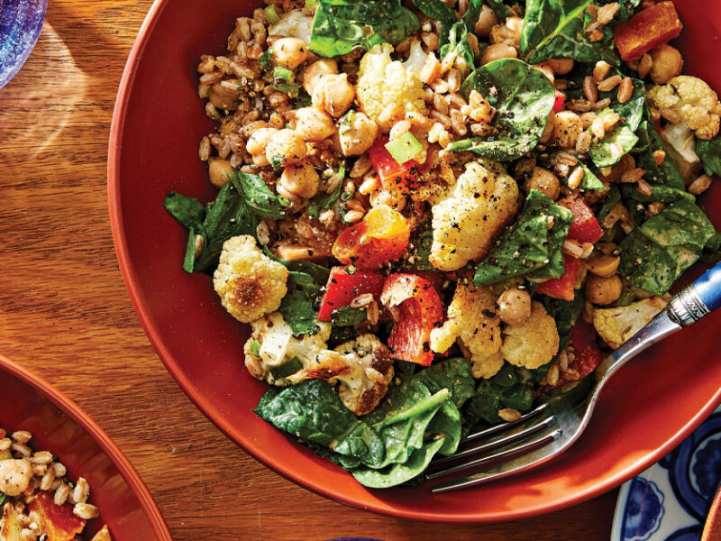 Moroccan Bean Salad in an orange bowl with a metal fork