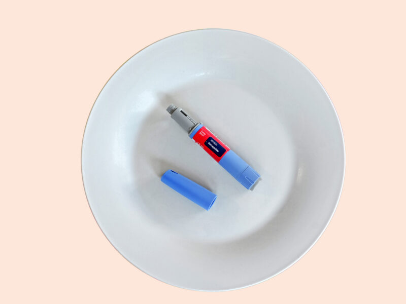 An injectable dose of semaglutide, the drug known as Ozempic and Wegovy, on a plain white plate