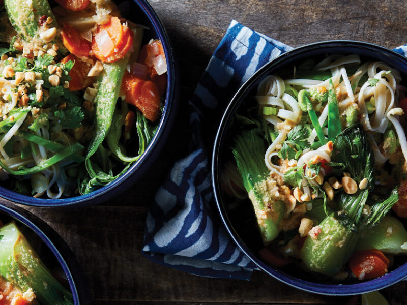 Thai Noodle Bowls with Bok Choy and Gluten-Free Peanut Sauce in dark blue ceramic bowls