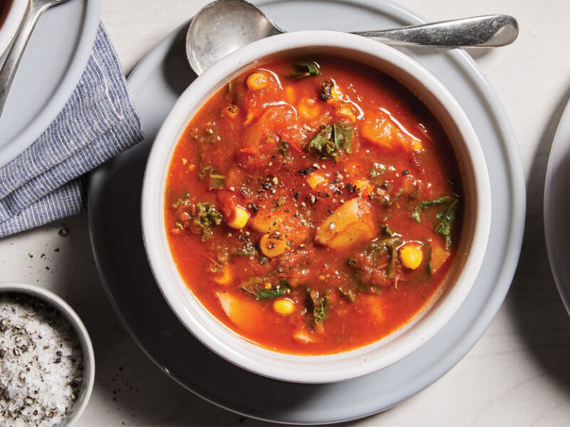 Roasted Vegetable Chowder in white ceramic bowls against a white tabletop