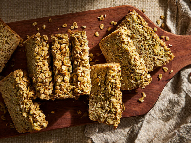 Irish Porridge Bread on a wooden paddle cutting board