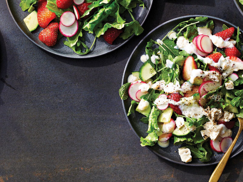 Strawberry-Radish Salad with Creamy Lemon Dressing on dark gray ceramic plates