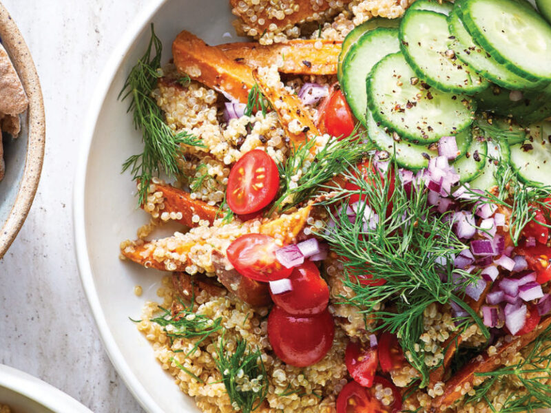 Shawarma Sweet Potato-Quinoa Bowl in a white ceramic bowl with a side of pita bread
