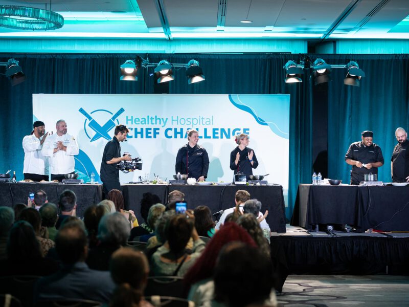 Photo of chefs competing in the first Healthy Hospital Chef Challenge competition in D.C., showcasing healthy plant-based hospital food