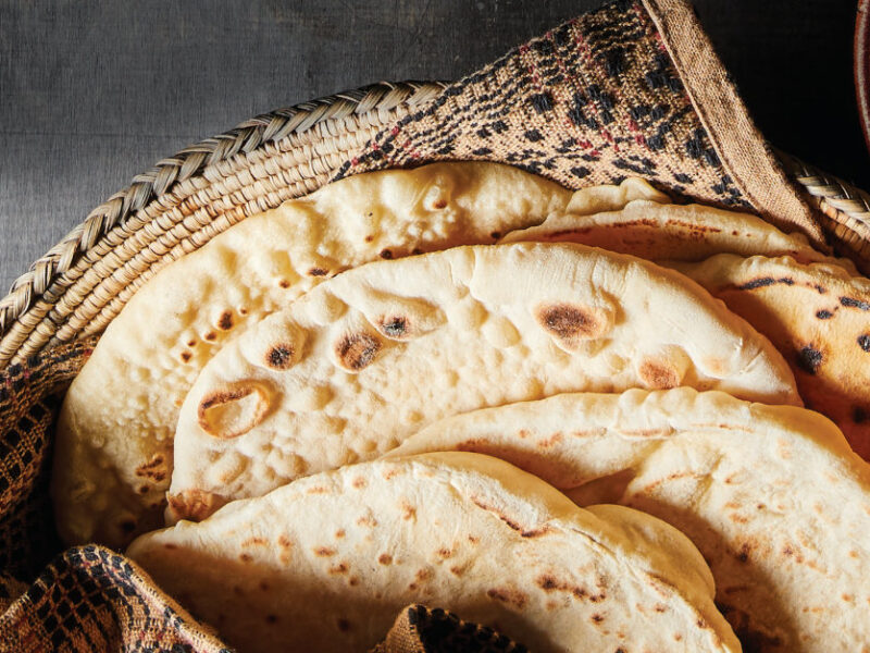 6 pieces of No-Fry Frybread on a cloth napkin in a woven plant-fiber bowl