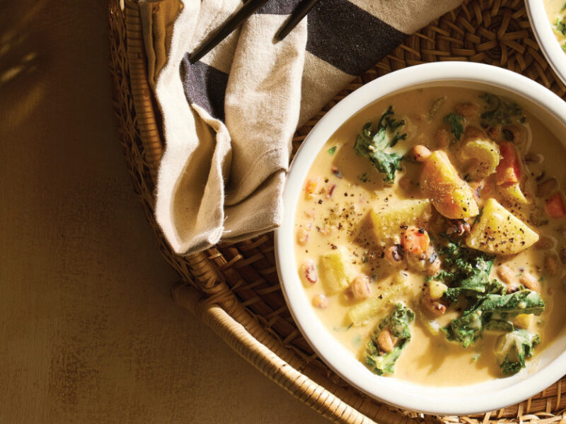 Two white serving bowls of Potato-Kale Black-Eyed Pea Soup