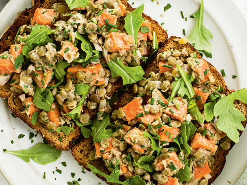 To slices of whole grain toast topped with Maple Mustard Lentils, Sweet Potatoes, and Herbs