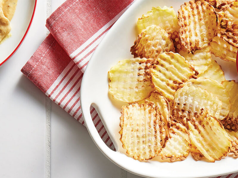 Waffle Fries with Dipping Sauce on a plate with a small bowl of dipping sauce