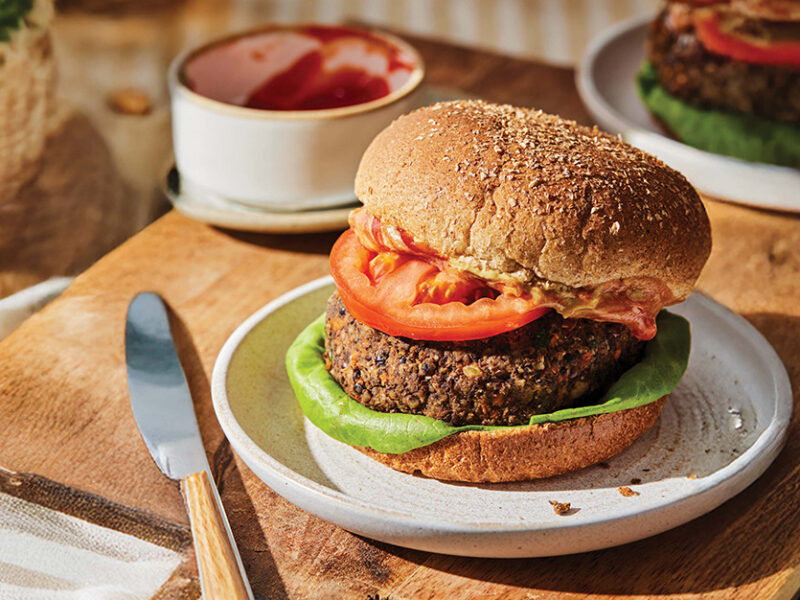 A 15-Minute Lentil Burgers ( on a plate on a wooden chopping board
