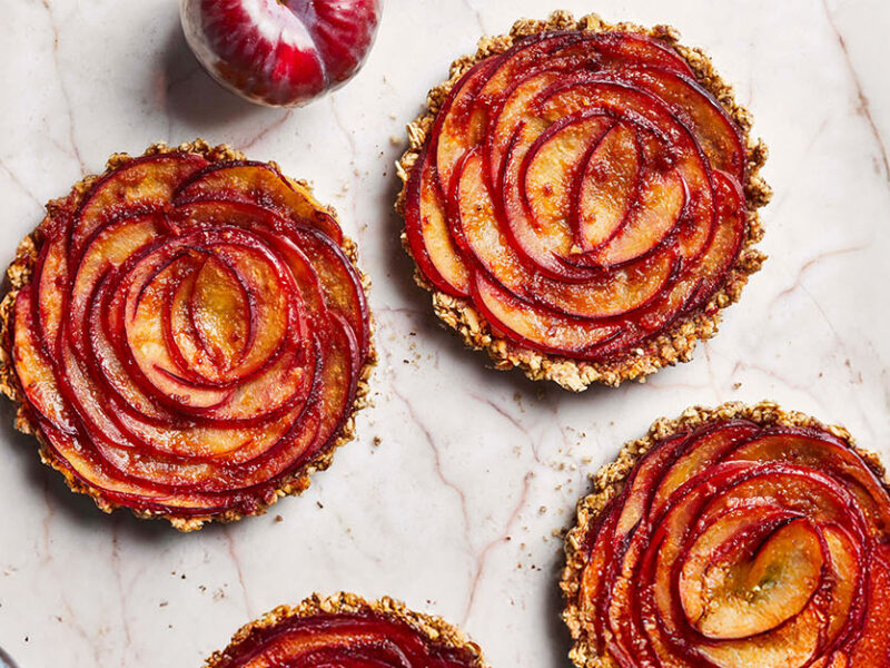 Plum Rosette Tarts on a marble counter