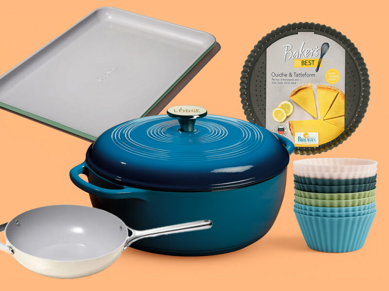Collage of various nonstick products including a Caraway baking sheet, Loge dutch oven, and quiche pan
