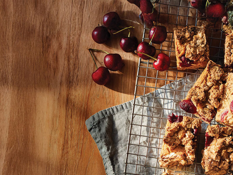 Slices of Cherry Coffee Cake on a wire cooling rack