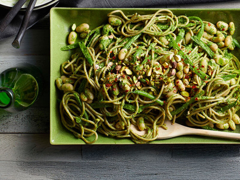 Green Bean Pasta with Cashew Pesto in a green ceramic serving platter