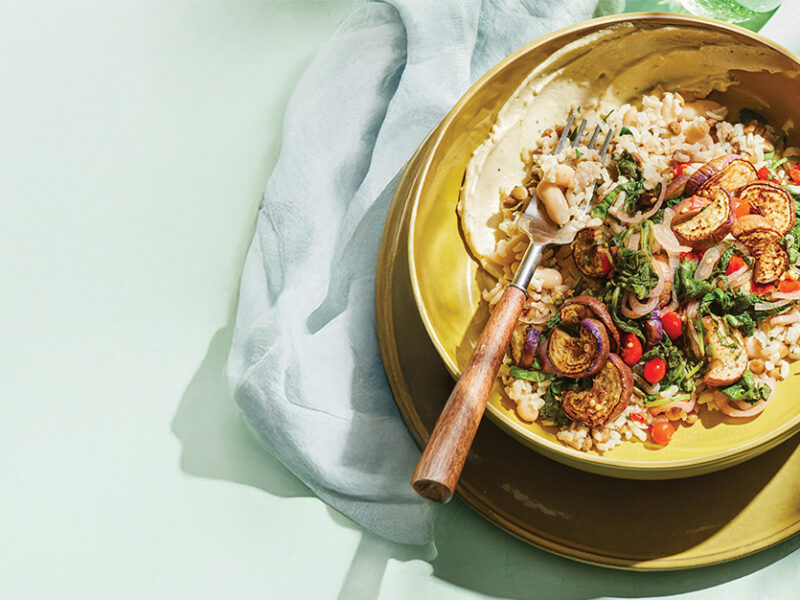 A plate of Sautéed Eggplant with Hearty Grains and Lemon-Garlic Aioli