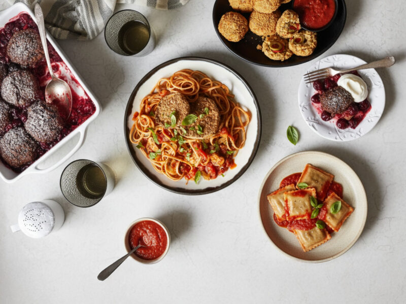 A vegan Valentine's day feast, featuring eggplant parm, arancini, ravioli, and a cherry chocolate cobbler