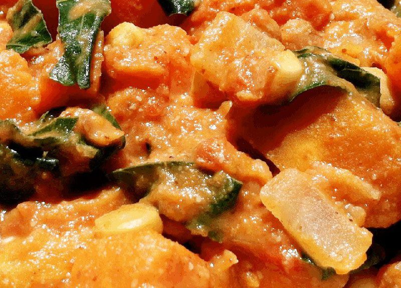 Close-up of African Yam Stew in a white bowl