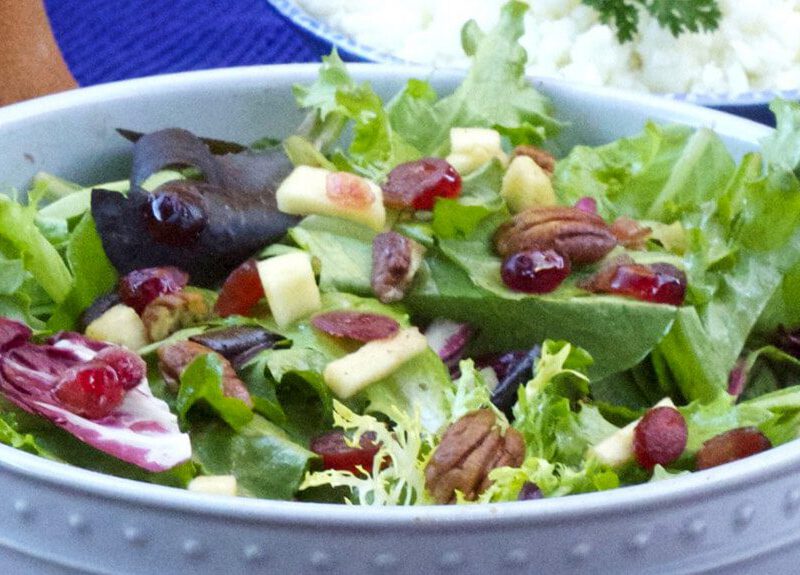 Autumn Mixed Greens Salad in a pale blue serving bowl