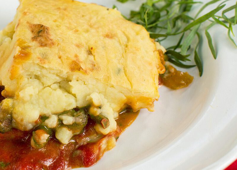A serving of Plant-Based Shepherd's Pie on a white plate