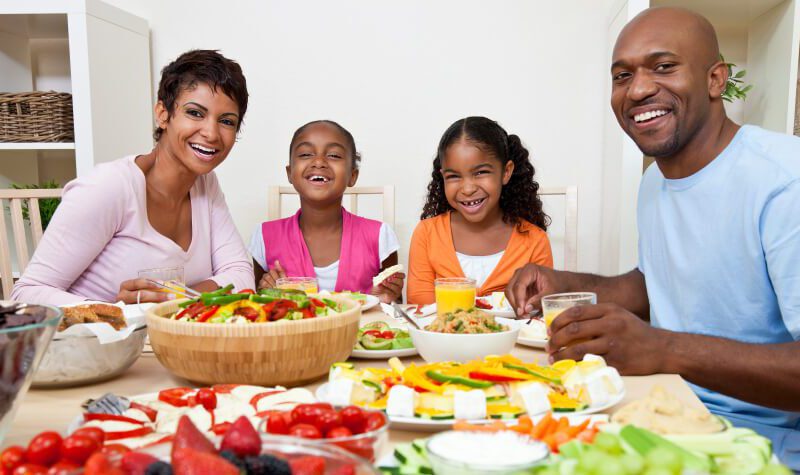 African American Parents Children Family Eating At Dining Table