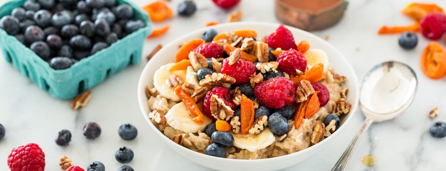 This basic healthy oatmeal recipe is all you need to get started on a delicious breakfast… add as much or as little of the extras (like fruit!) as you like.