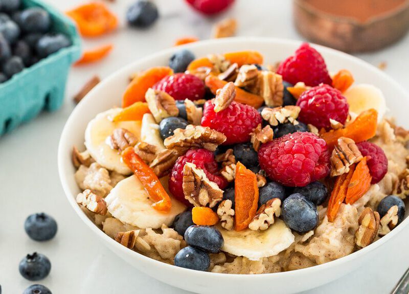 This basic healthy oatmeal recipe is all you need to get started on a delicious breakfast… add as much or as little of the extras (like fruit!) as you like.