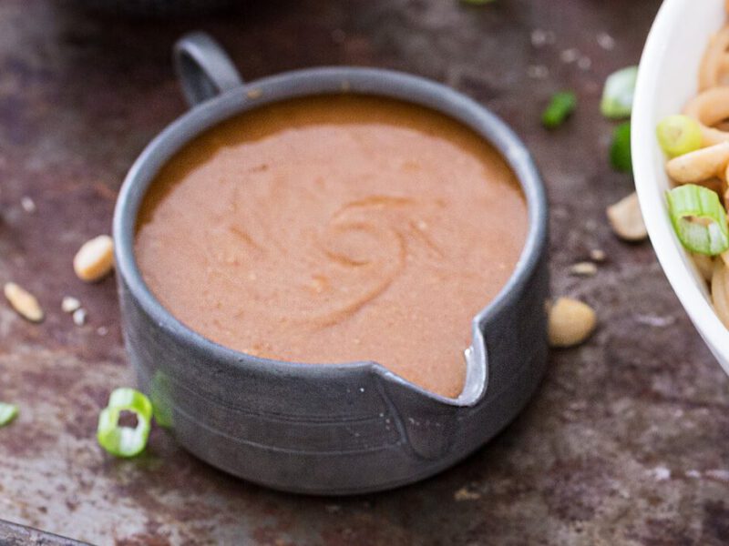 A grey jug of peanut sauce