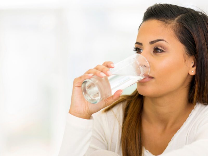 Young woman drinking water
