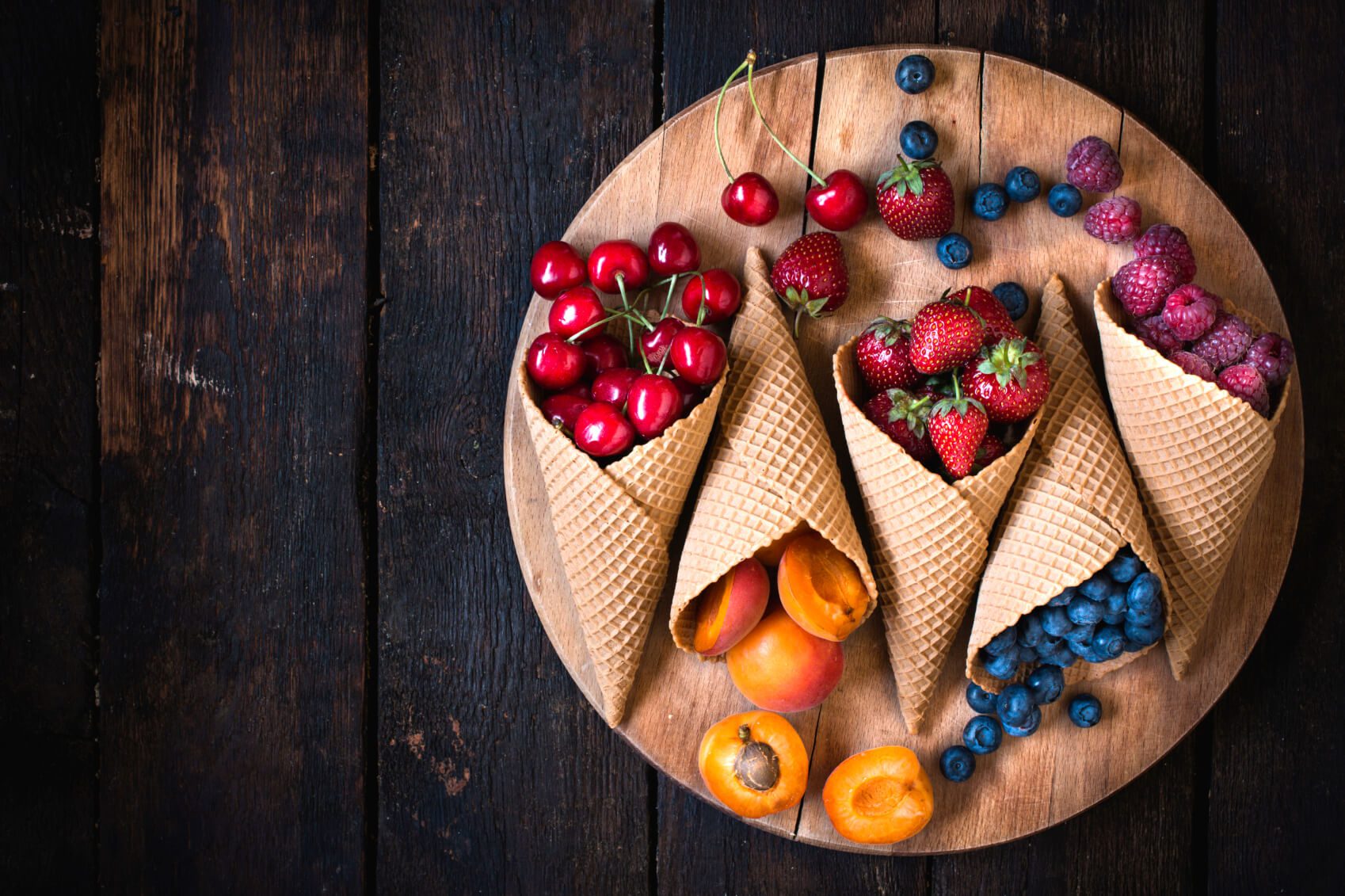 Fresh fruits in ice cream cone