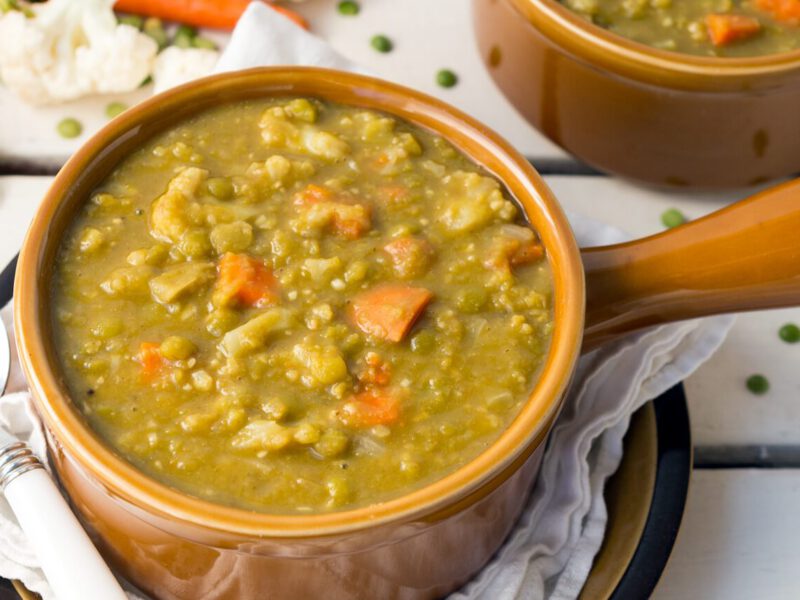 Split Pea & Cauliflower Soup in a brown, ceramic serving bowl with a handle