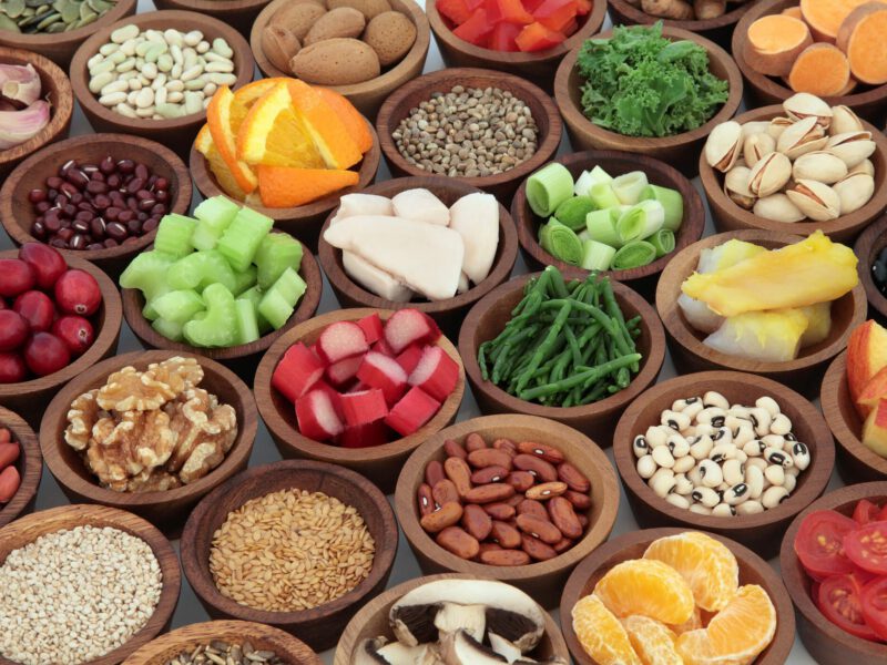 Healthy super food collection in wooden bowls. High in antioxidants, vitamins, minerals and anthocyanins.