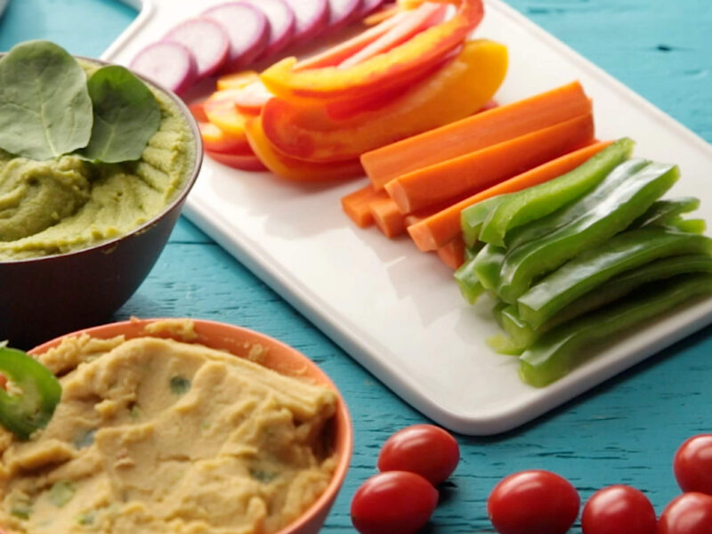 creamy oil-free hummus shown alongside a tray of crudites
