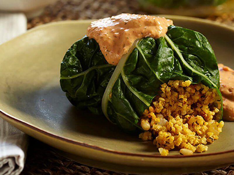 A Millet-Stuffed Chard Roll with Roasted Red Pepper Sauce