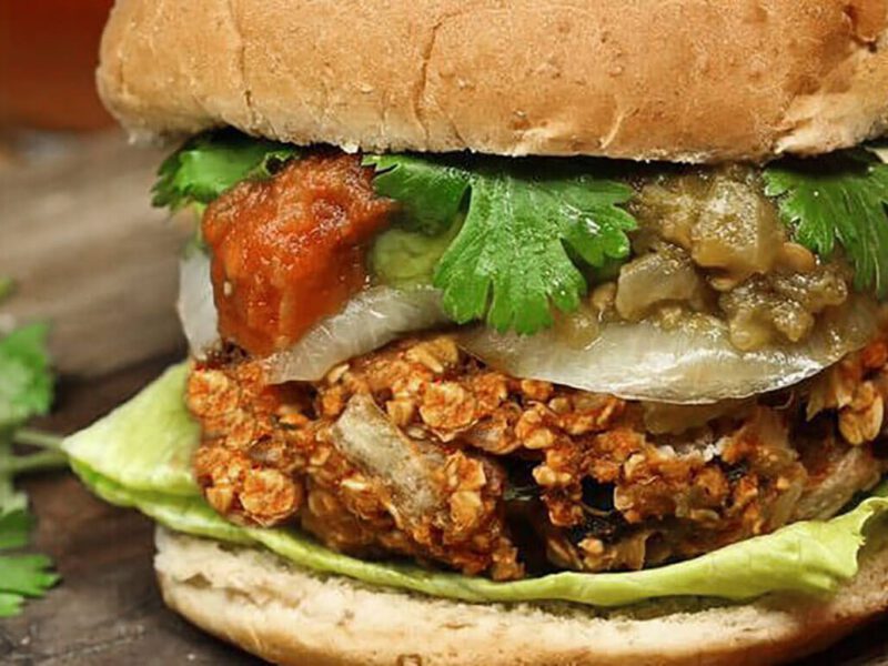 Mexican Veggie Burger and fresh cilantro on a wooden chopping board