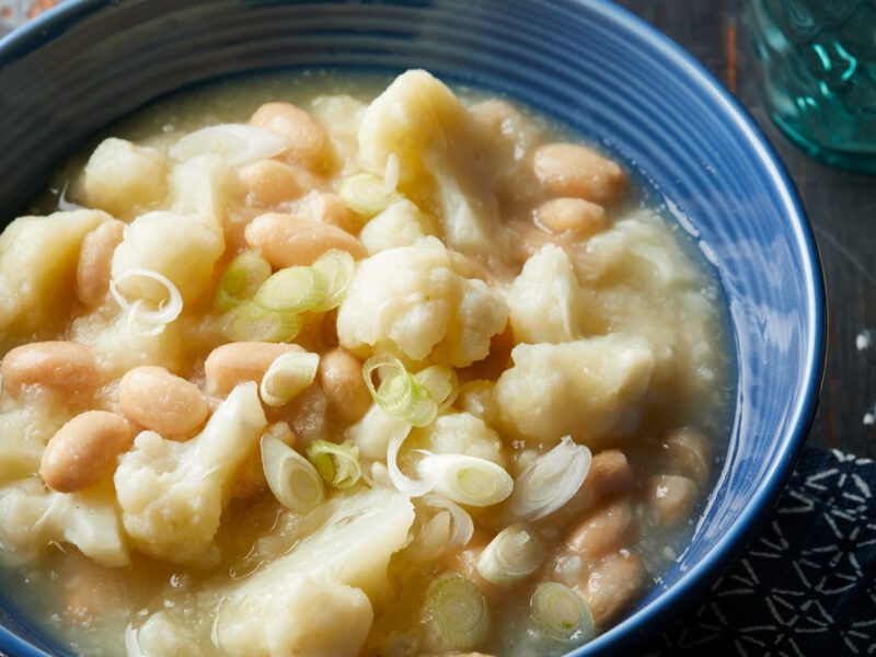 Creamy Caulilflower and White Bean Soup in blue bowl