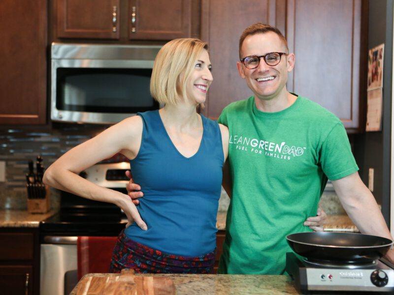 Cory and Jenn Warren arm in arm in their kitchen
