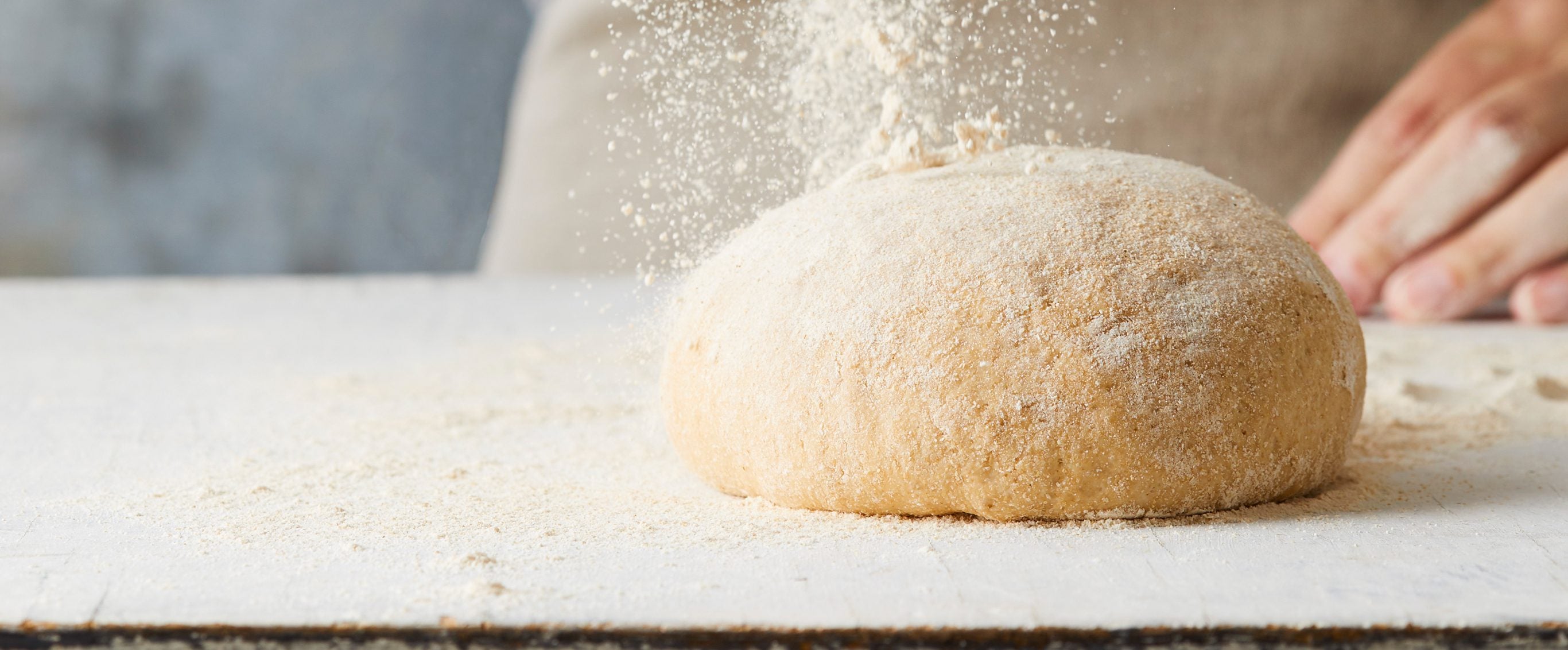 Pizza dough with flour sprinkled over