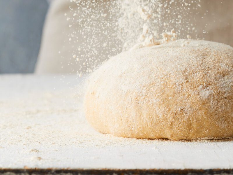 Pizza dough with flour sprinkled over