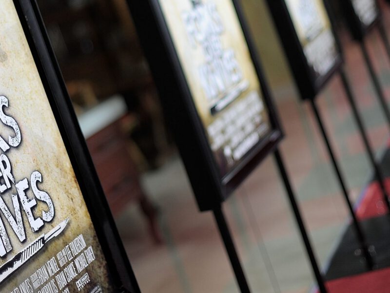 Red carpet lined with Forks Over Knives movie promo posters