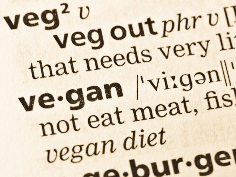 A close-up of the dictionary entry for the word "vegan"