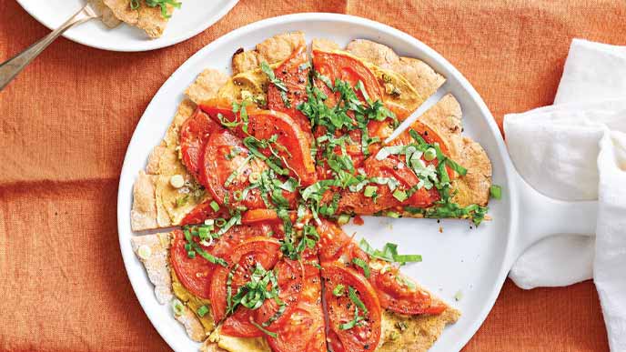 Tangy Tomato Tart with Hummus on a white plate