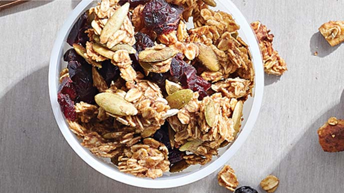 Pumpkin-Cranberry Granola in a small white bowl